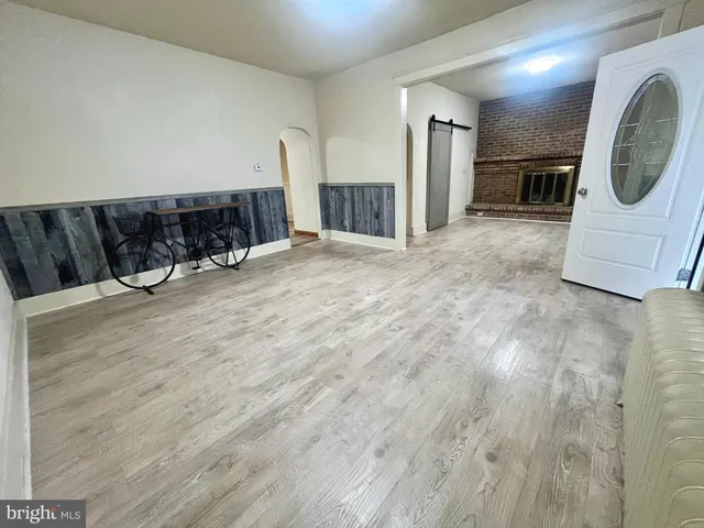 an empty room with a fireplace