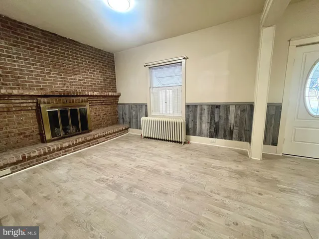 a view of a livingroom with furniture and closet
