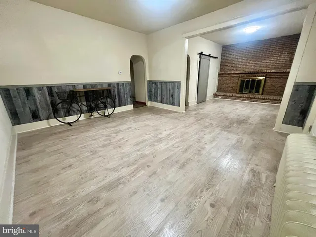 a kitchen with a stove a refrigerator and a stove top oven