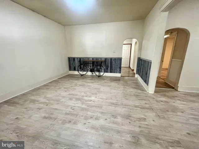 a view of a dining room with furniture and a kitchen