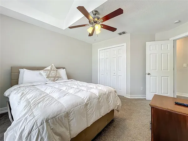 a bedroom with a bed and window