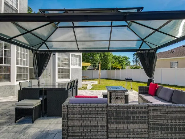 a view of swimming pool with seating space