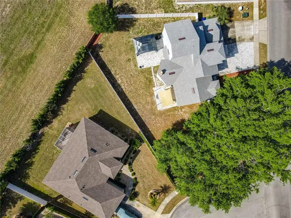 an aerial view of a house with outdoor space
