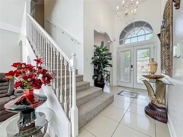 a view of hall way with furniture