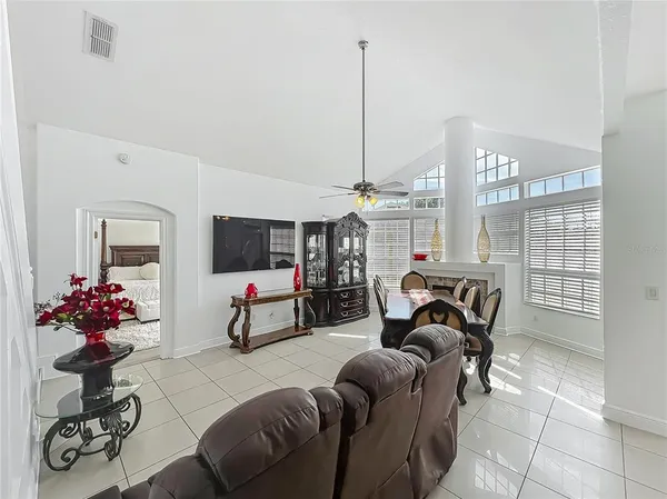 a bedroom with furniture and a gym equipment