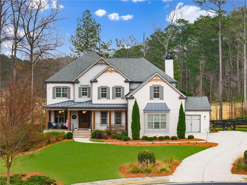 3700 Muirfield Drive Milton, GA 30004 - Photo 1 of 1 a front view of a house with a yard