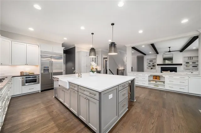 a view of a house with swimming pool and sitting area