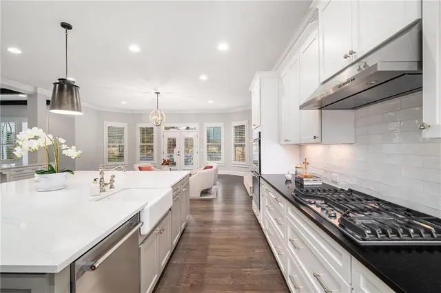 a bathroom with a sink mirror and toilet