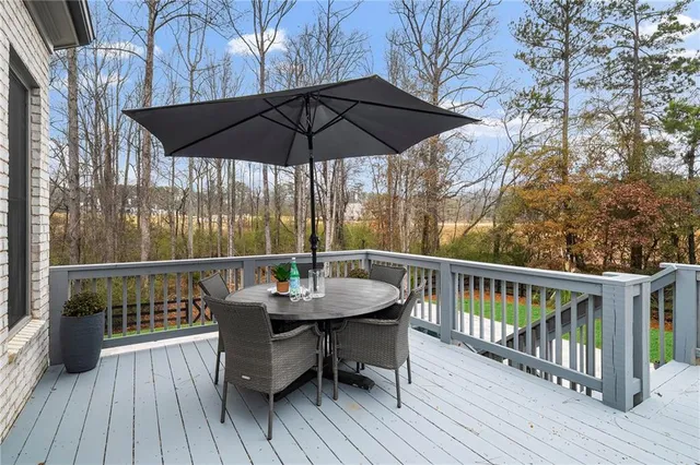 a bathroom with a double vanity sink a mirror a bathtub and shower