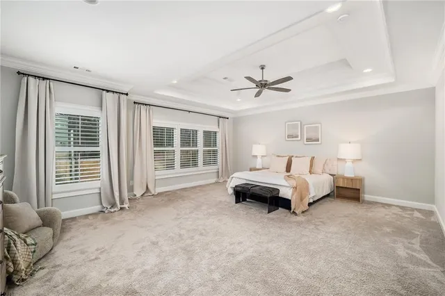 a view of an empty room with a ceiling fan