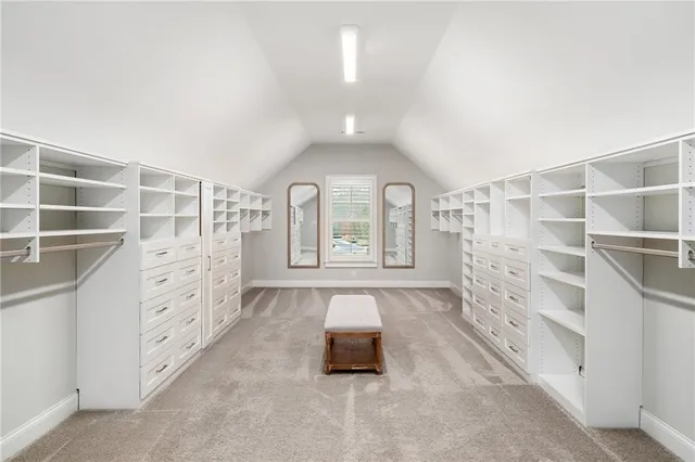 a bathroom with a granite countertop sink toilet mirror and shower