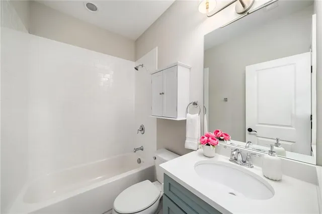 a view of an house with backyard and a garage