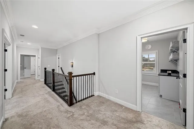 a view of an house with backyard and a tree