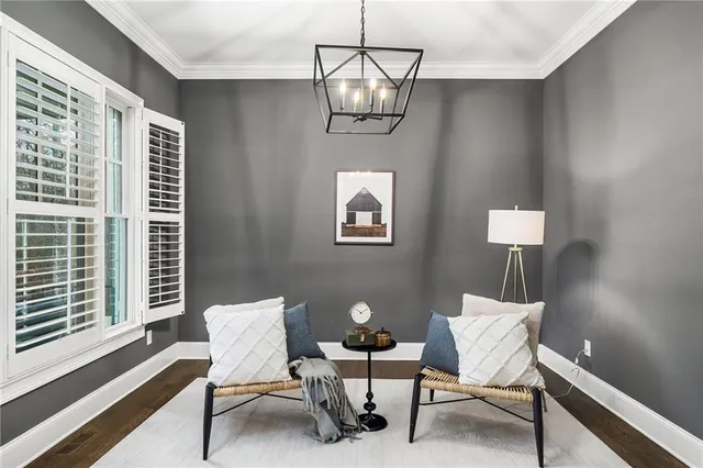 a kitchen with stainless steel appliances granite countertop a sink a stove a refrigerator and island with wooden floor