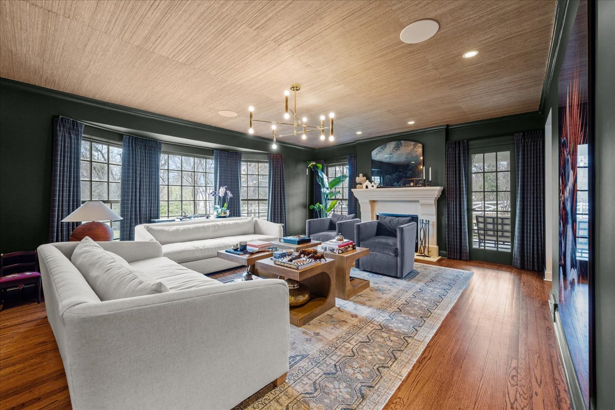 2335 Pebblefork Lane Northfield, IL 60093 - Photo 16 of 92 a living room with fireplace furniture and a wooden floor