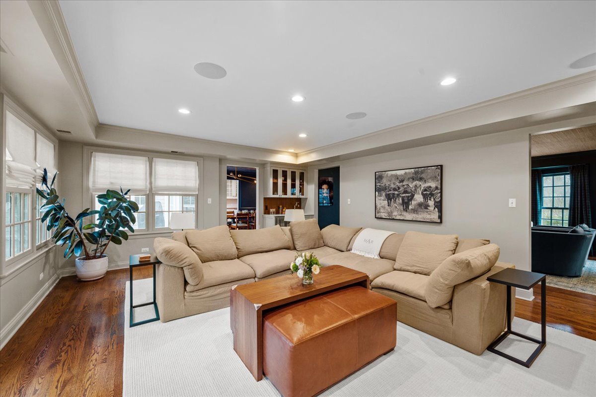 2335 Pebblefork Lane Northfield, IL 60093 - Photo 21 of 92 a living room with furniture potted plant and wooden floor