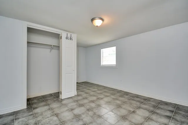 a view of kitchen with refrigerator sink and cabinets