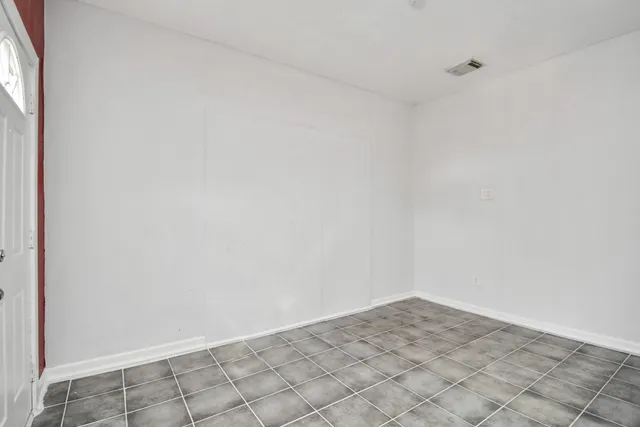 a kitchen with a stove and a refrigerator