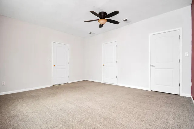 a bathroom with a sink and mirror with toilet