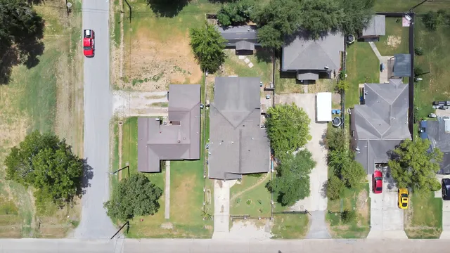 an aerial view of houses with outdoor space