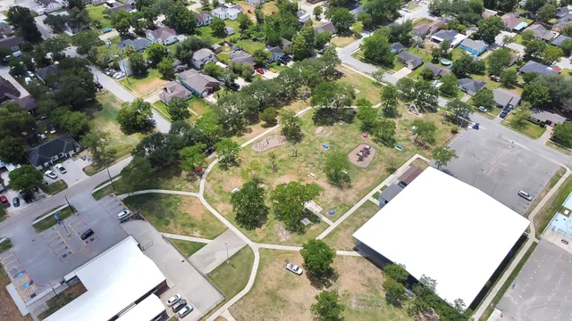 an aerial view of residential houses with outdoor space
