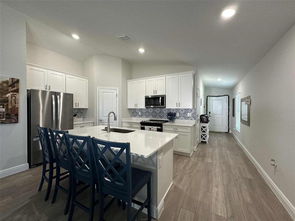 6245 Southwest 96th Place Ocala, FL 34476 - Photo 11 of 38 a large kitchen with a table and chairs