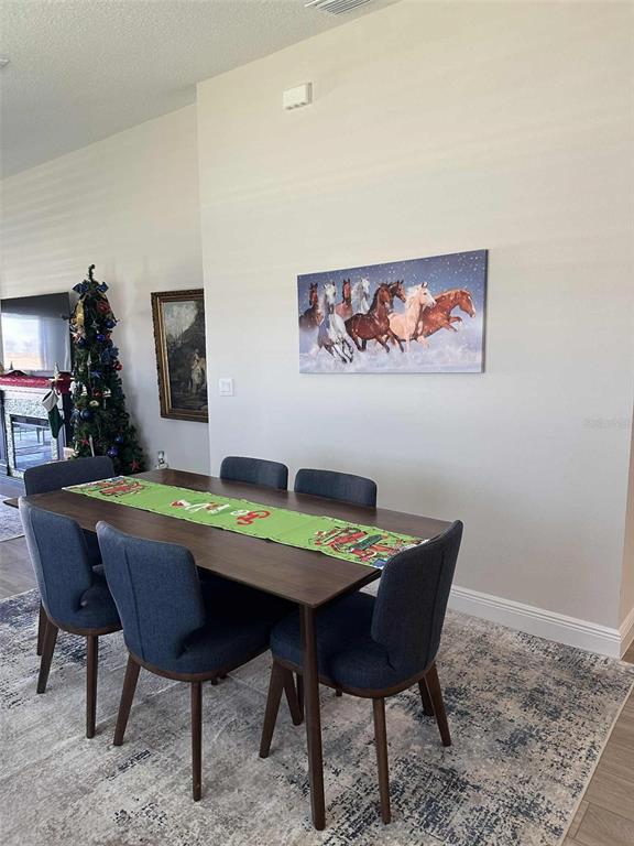 6245 Southwest 96th Place Ocala, FL 34476 - Photo 13 of 38 a view of a dining room with furniture