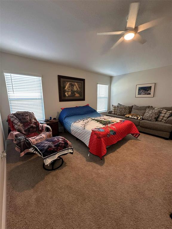 6245 Southwest 96th Place Ocala, FL 34476 - Photo 24 of 38 a bedroom with bed couch and window