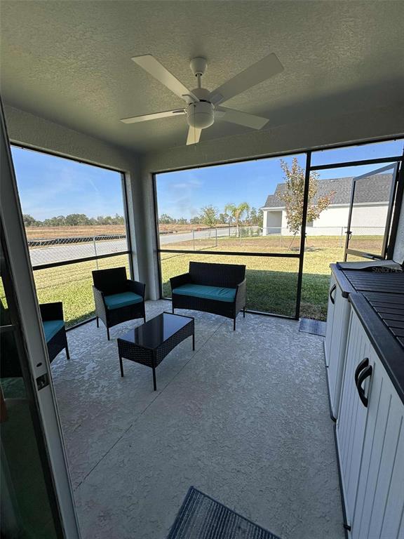 6245 Southwest 96th Place Ocala, FL 34476 - Photo 32 of 38 a living room with furniture and a flat screen tv