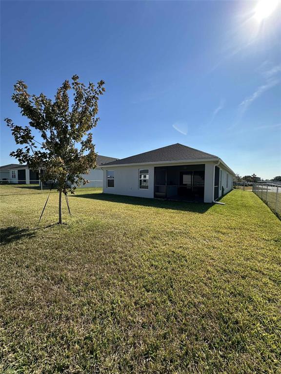 6245 Southwest 96th Place Ocala, FL 34476 - Photo 35 of 38 a view of a house with a yard