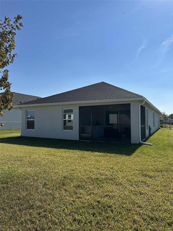6245 Southwest 96th Place Ocala, FL 34476 - Photo 36 of 38 a view of a house with a yard