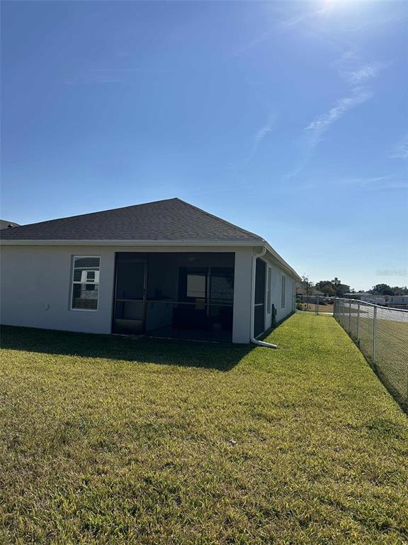 6245 Southwest 96th Place Ocala, FL 34476 - Photo 37 of 38 a view of a house with a yard