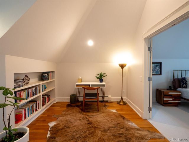 a room with furniture and a book shelf
