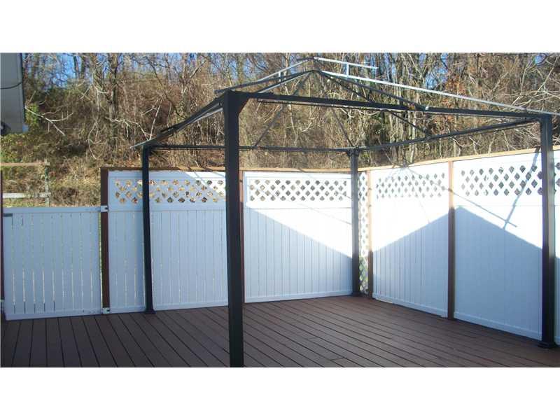 1515 Blue Star Road Perryopolis, PA 15473 - Photo 8 of 25 Patio/Deck. Large private deck off of Master Suite with curtain-enclosed canopy for maximum privacy!