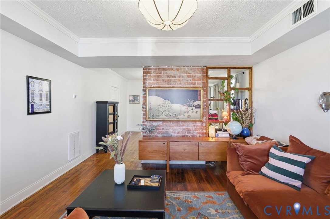 1602 Decatur Street Richmond, VA 23224 - Photo 11 of 25 a living room with a couch and a table