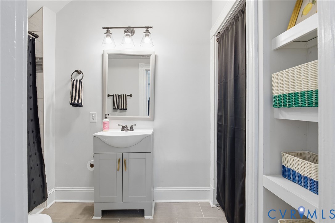 1602 Decatur Street Richmond, VA 23224 - Photo 14 of 25 a bathroom with a sink toilet and mirror