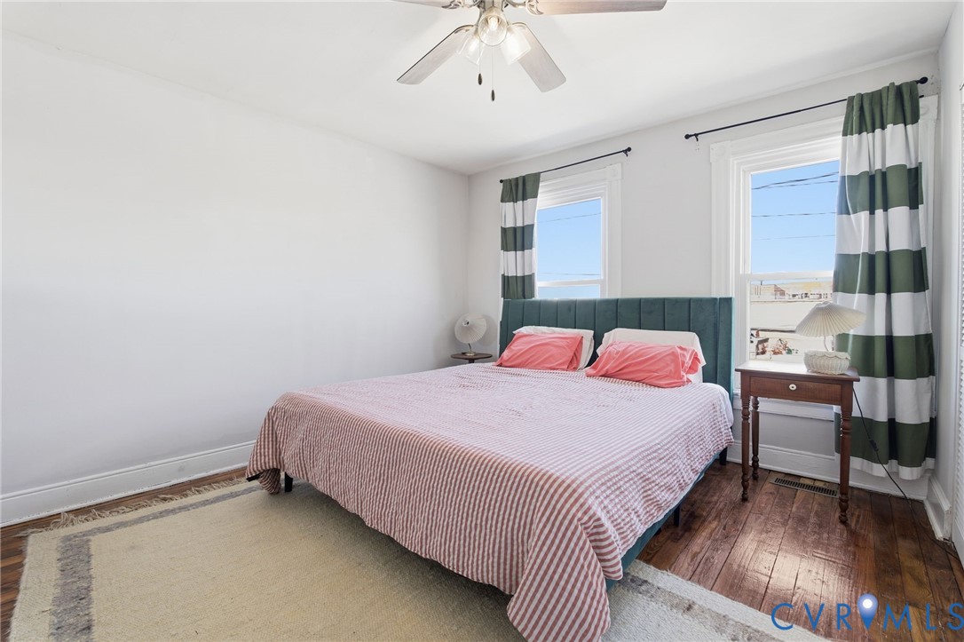 1602 Decatur Street Richmond, VA 23224 - Photo 18 of 25 a bedroom with a bed and a chandelier