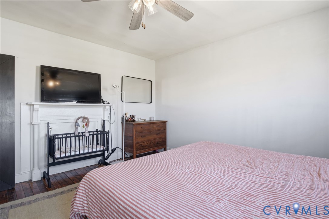 1602 Decatur Street Richmond, VA 23224 - Photo 20 of 25 a bedroom with a bed and a flat screen tv