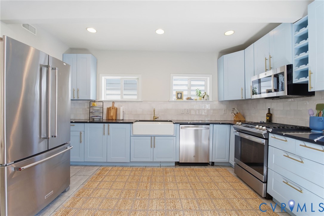 1602 Decatur Street Richmond, VA 23224 - Photo 2 of 25 a kitchen with stainless steel appliances granite countertop a refrigerator sink and stove