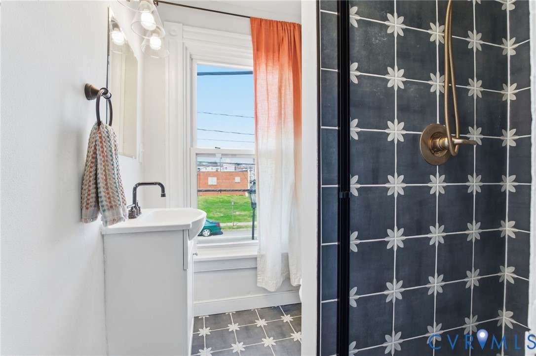 1602 Decatur Street Richmond, VA 23224 - Photo 22 of 25 a bathroom with a sink toilet and shower