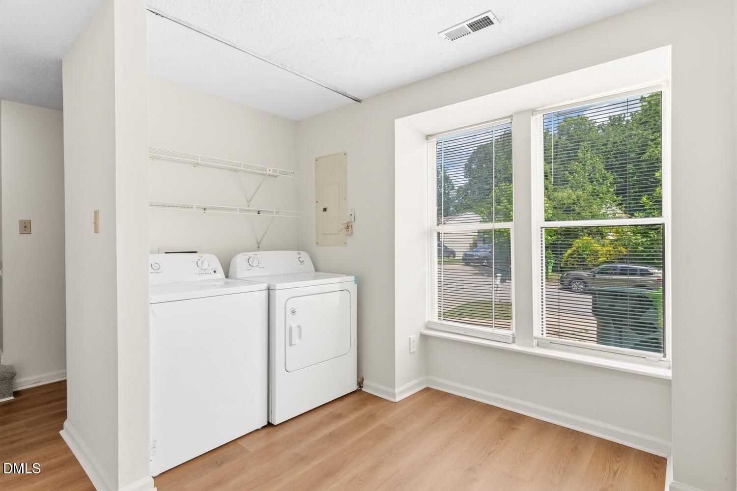 1135 Villa Green Court Raleigh, NC 27612 - Photo 7 of 17 a utility room with dryer and washer