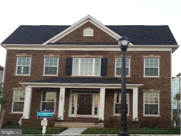 7207 Maisson Ridge Circle Beltsville, MD 20705 - Photo 1 of 5 a front view of a house with garden