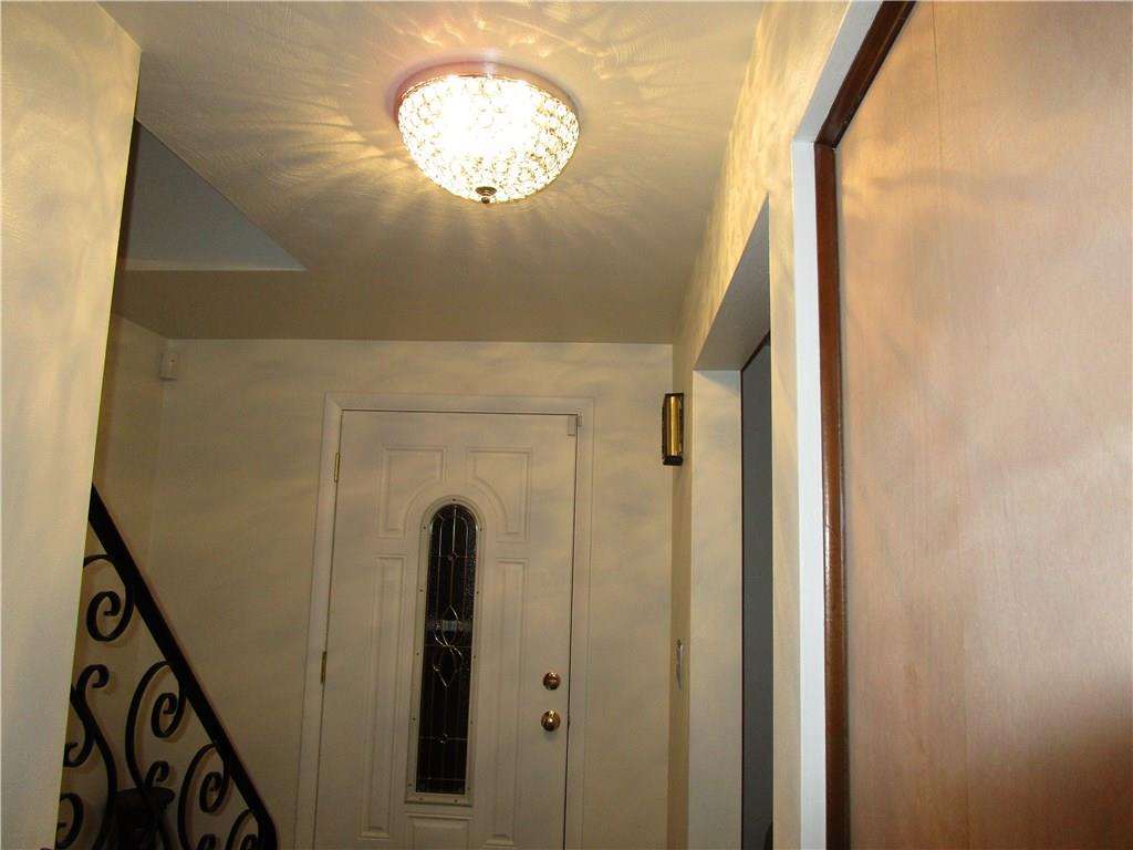 10125 Buchannon Road Pittsburgh, PA 15235 - Photo 2 of 25 Welcoming Foyer, Rod Iron Railing, newer door & lighting!