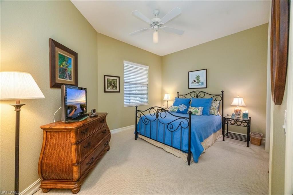 8637 Champions Point, Unit 902 Naples, FL 34113 - Photo 18 of 26 Carpeted bedroom featuring baseboards and ceiling fan
