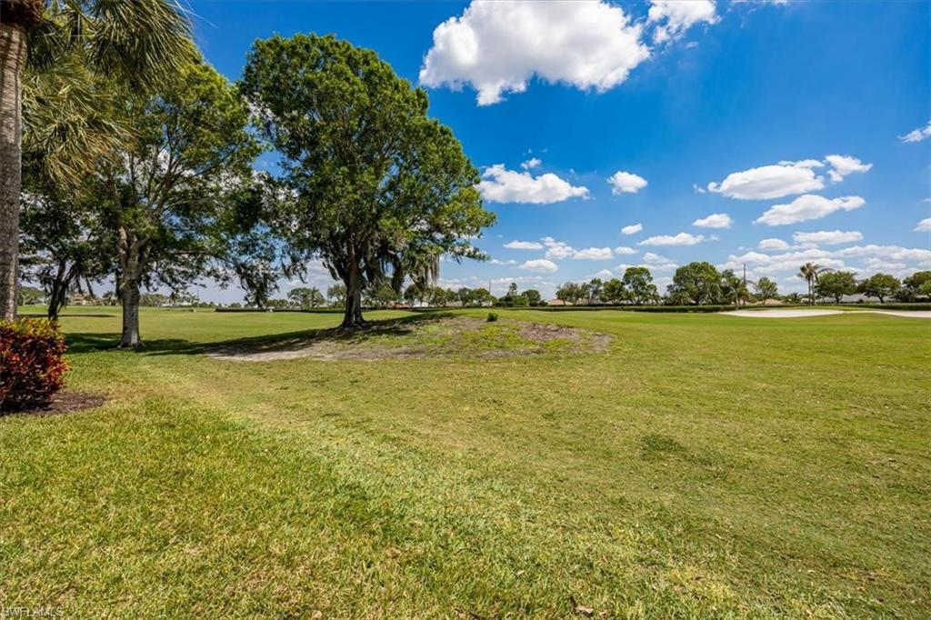 8637 Champions Point, Unit 902 Naples, FL 34113 - Photo 25 of 26 View of yard
