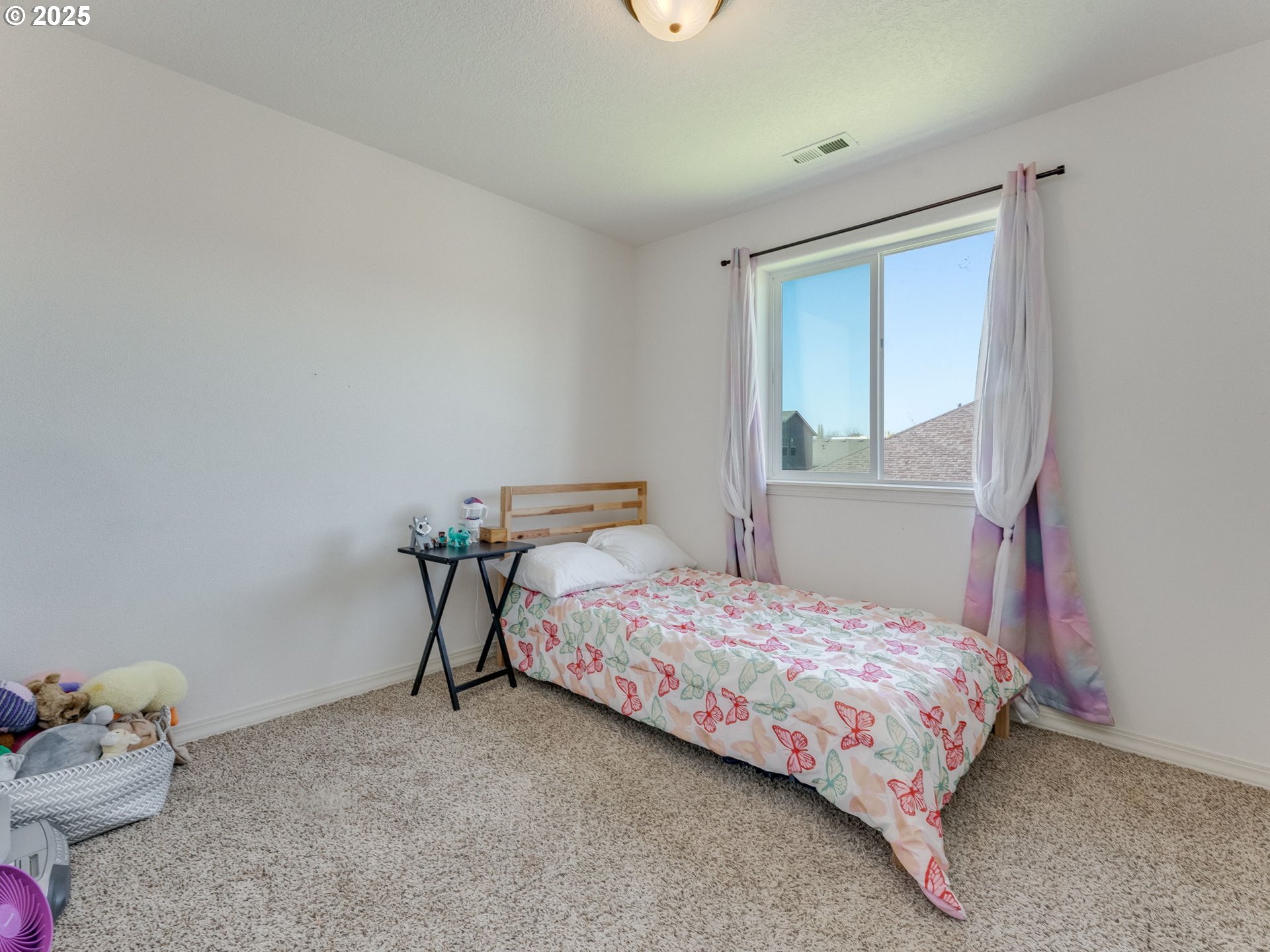 230 Northwest Sagan Loop Sheridan, OR 97378 - Photo 15 of 26 a bedroom with a bed and a window