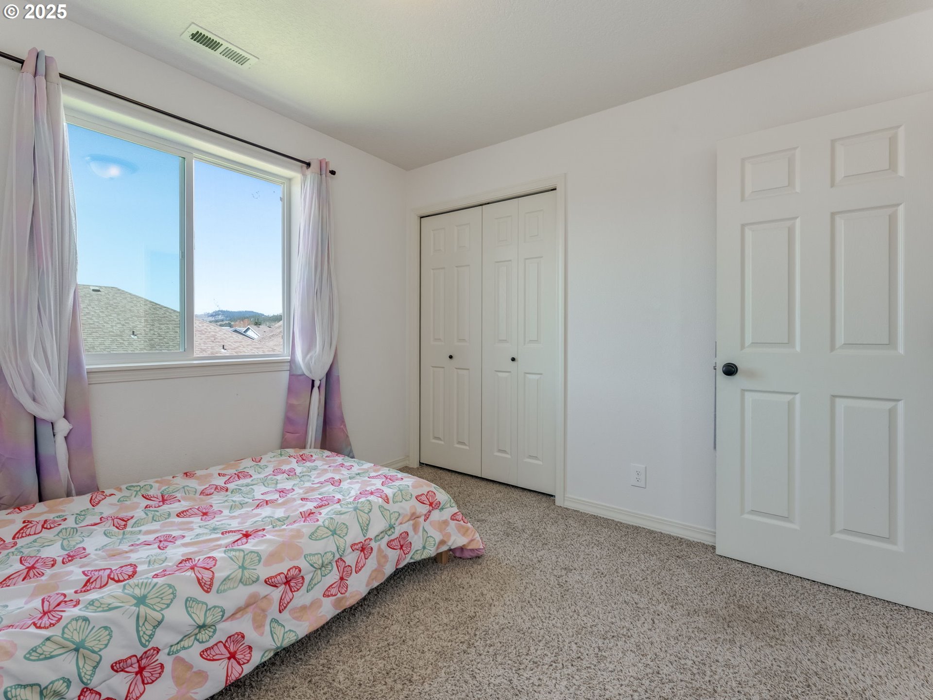 230 Northwest Sagan Loop Sheridan, OR 97378 - Photo 16 of 26 a bedroom with a bed and a window