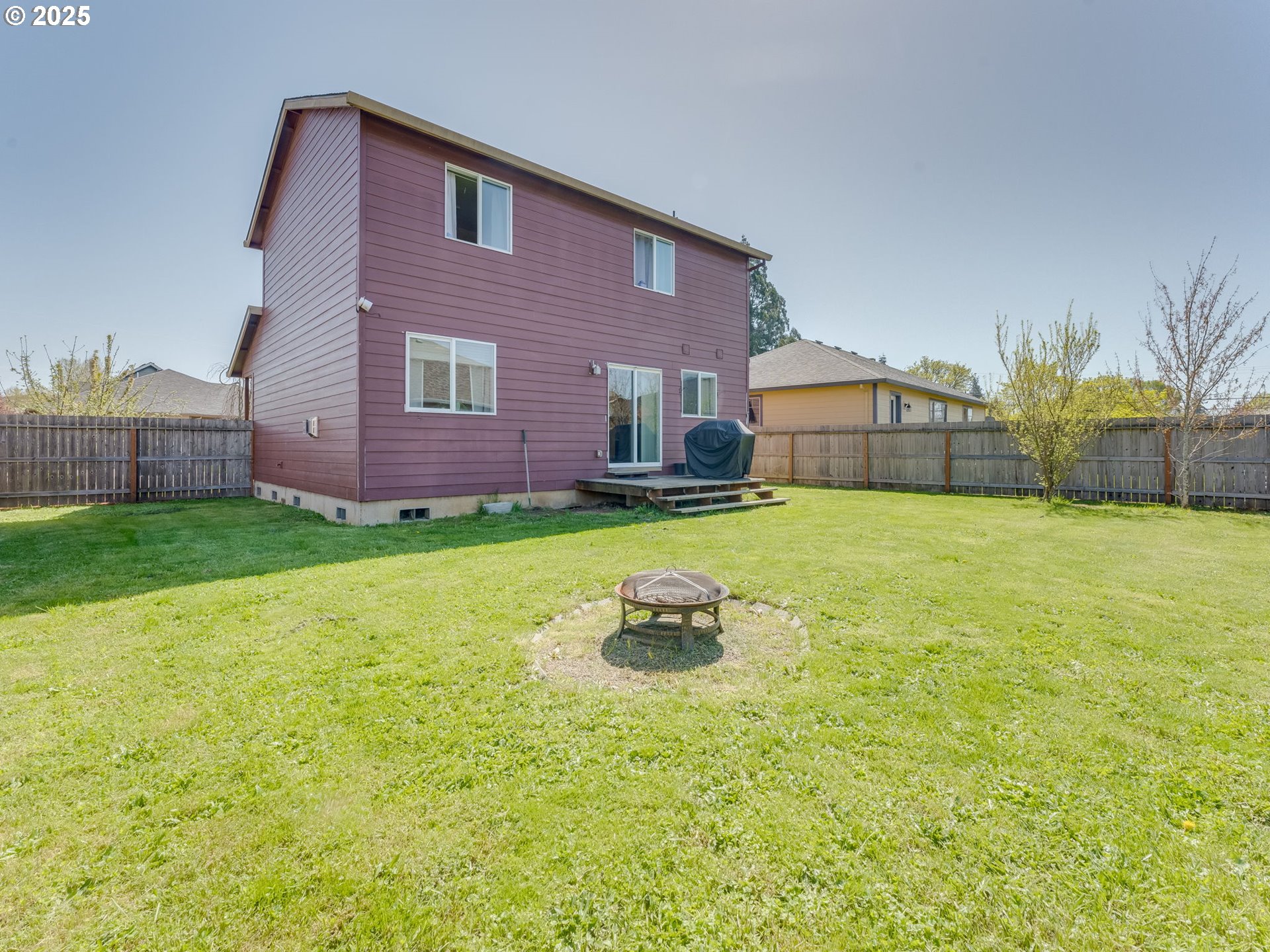 230 Northwest Sagan Loop Sheridan, OR 97378 - Photo 21 of 26 a backyard of a house with lots of green space and fountain