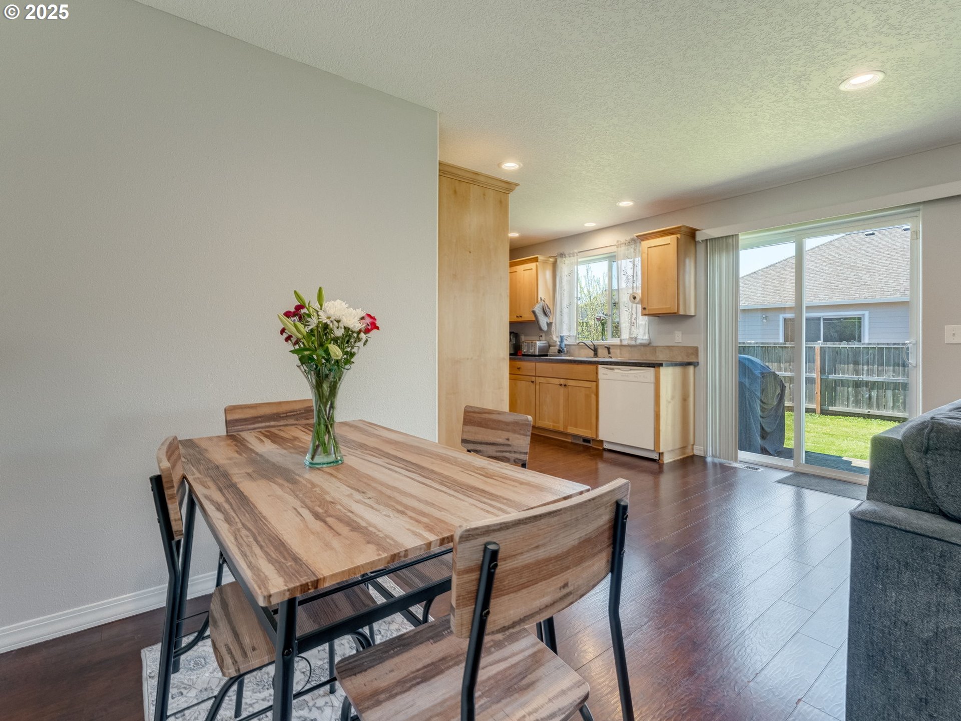 230 Northwest Sagan Loop Sheridan, OR 97378 - Photo 7 of 26 a view of a dining room with furniture window and wooden floor