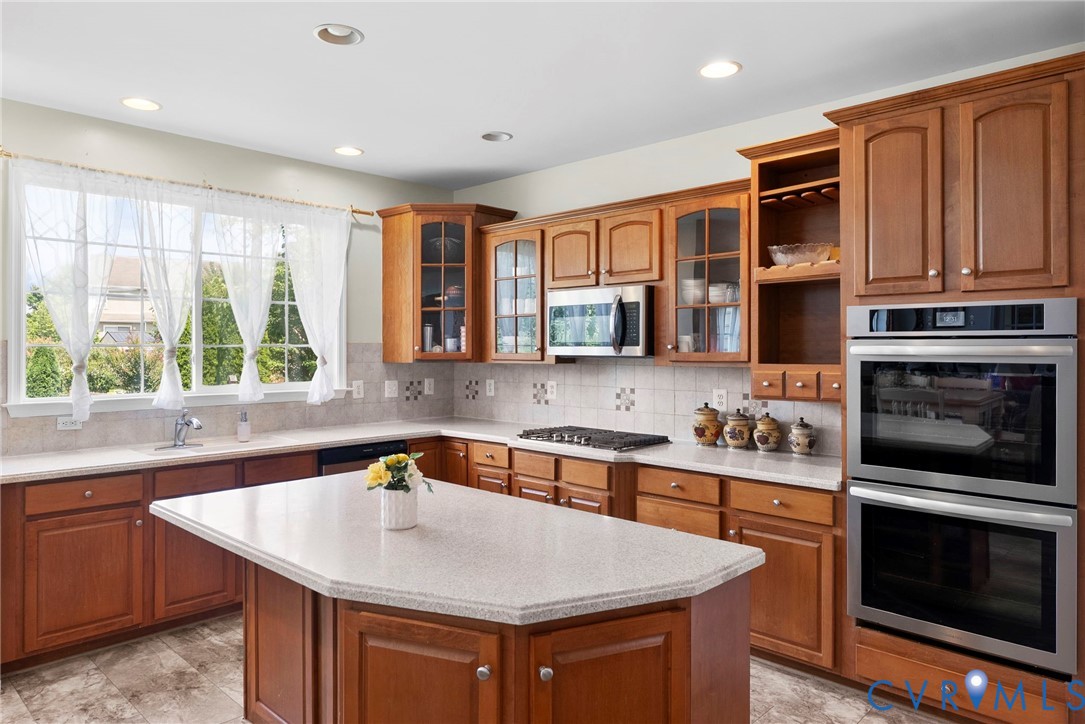 753 Blossom Tree Road Culpeper, VA 22701 - Photo 28 of 68 Kitchen featuring an island, light-toned counterto